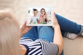 Closeup view of senior woman talking with grandchildren via video chat