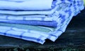 Closeup view on a set kitchen towels on wooden background in nature.Blurred background.