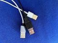 USB Charger Cables on a Blue Background Royalty Free Stock Photo