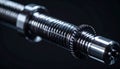Closeup of a silver threaded rod with gear and nut on dark background Royalty Free Stock Photo