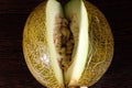 Sliced melon on dark wooden table