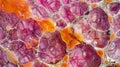 A closeup view of a stained thin section of animal skin showing an intricate network of pink and orange cells. .