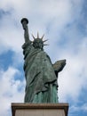 Closeup view of Statue of Liberty replica sculpture on Ile aux Cygnes at Pont de Grenelle Seine river Paris France Royalty Free Stock Photo