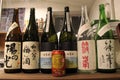 Closeup view of Suntory beer can among Japanese sake