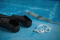 Closeup view on swimming accessories at poolside, selective focus