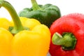 Closeup view of three coloured pepper isolated white Royalty Free Stock Photo
