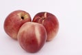 Three ripe peaches on white Royalty Free Stock Photo