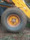 Closeup of a tire below the vehicle part of an Earth mover