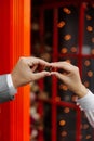 Closeup view to newlyweds holding wedding rings in their hands Royalty Free Stock Photo