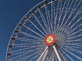 Closeup view of the top of a big Ferris wheel in park Wurstelprater in Vienna, Austria with white frame and flower symbol. Royalty Free Stock Photo