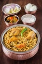 Chicken biryani with traditional sides