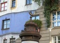 Closeup view of the top of the Kunst Haus Museum Column, in front of famous Hundertwasser House, Vienna, Austria