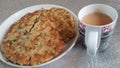 Closeup view of of traditional bread called Jawar roti or bhakri with tea cup Royalty Free Stock Photo