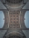 Closeup view underneath triumphal Arch, in Paris, France. Architectural details and ceiling ornate pattern of the famous Arc de Royalty Free Stock Photo