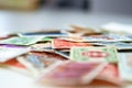 Closeup view on a variety of multi-colored postage stamps from different countries and years. Selective focus