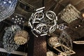 Nice closeup view of various beautiful, luxury stylish interior decorative ceiling lights on dark background Royalty Free Stock Photo