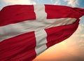 Closeup view of the waving Danish flag on a background of sunset