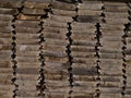 View of weathered pile of stacked wooden planks with wood texture. Royalty Free Stock Photo