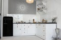 Closeup view on a white and black kitchen and black glass door Royalty Free Stock Photo