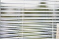 Closeup view of window with horizontal blinds