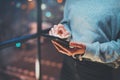 Closeup view of woman holding modern mobile phone in hands.Girl pointing fingers on empty touch mobile screen at night