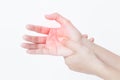Closeup view of woman massaging her painful hand isolated on a white background. Hands of asian young girl have inflammation