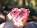 Pink crystal heart in hand Royalty Free Stock Photo