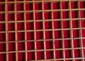 Closeup view of Wooden isolated boxes with red fabric making abstract bg