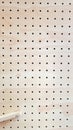 Closeup view of wooden pegboard Royalty Free Stock Photo