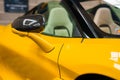 Closeup view of a Yellow McLaren 765LT featuring a Carbon Fiber Mirror.