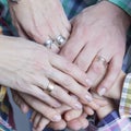 Closeup View of Young Caucasian People Connecting Their Hands Together