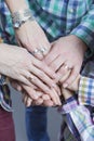 Closeup View of Young Caucasian People Connecting Their Hands Together