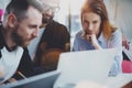 Closeup view of young Coworkers working together on new business presentation at sunny meeting room.Horizontal.Blurred Royalty Free Stock Photo