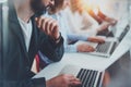 Closeup view of young Coworkers working together on new business presentation at sunny meeting room.Horizontal.Blurred Royalty Free Stock Photo