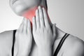 Closeup view of a young woman with pain on neck or thyroid gland Royalty Free Stock Photo