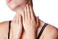 Closeup view of a young woman with pain on neck or thyroid gland. Royalty Free Stock Photo