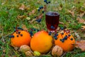 Closeup vine glass among heap of orange and fruits