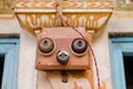 Closeup of a vintage doorbell on an old Indian building