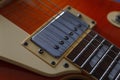 Closeup of vintage electric guitar. Detail, selective focus. Low key. Royalty Free Stock Photo