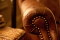 Closeup of vintage English leather armchair with buttons Royalty Free Stock Photo