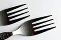 Closeup of vintage engraved silverware forks isolated on a white background