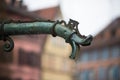 vintage fountain on medieval buildings on background in Colmar - France