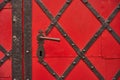 Old riveted metal red painted door Royalty Free Stock Photo