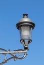 Closeup of vintage modern metal street lantern or lamp against blue sky in Torremolinos, spain, andalusia. Macro Royalty Free Stock Photo