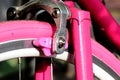 closeup of vintage style racing bicycle fork and front brake. pink rubber tire and brake pads Royalty Free Stock Photo