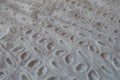 Closeup of vintage white eyelet embroidery cotton fabric