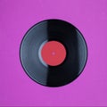 Closeup of Vinyl Long Play Record with Label with Copy Space on pink background