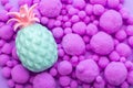 Closeup of violet balls of different sizes with blue and pink small pineapple on Royalty Free Stock Photo