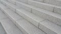 Closeup view of grey concrete stairs with dark concrete lines on footsteps