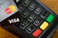 Closeup of VISA credit cards on the credit card machine.